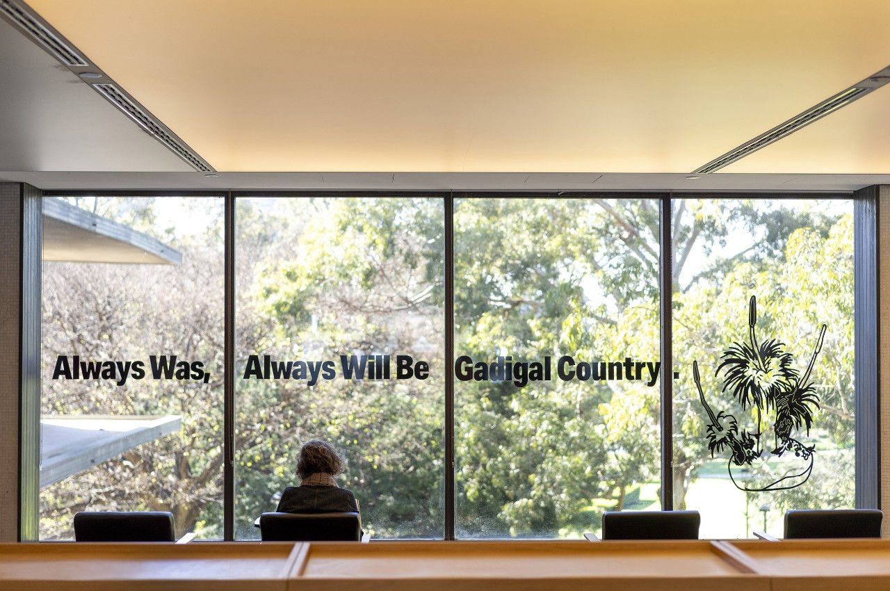 Image showing "Always was, always will be" decals in Fisher Library foyer
