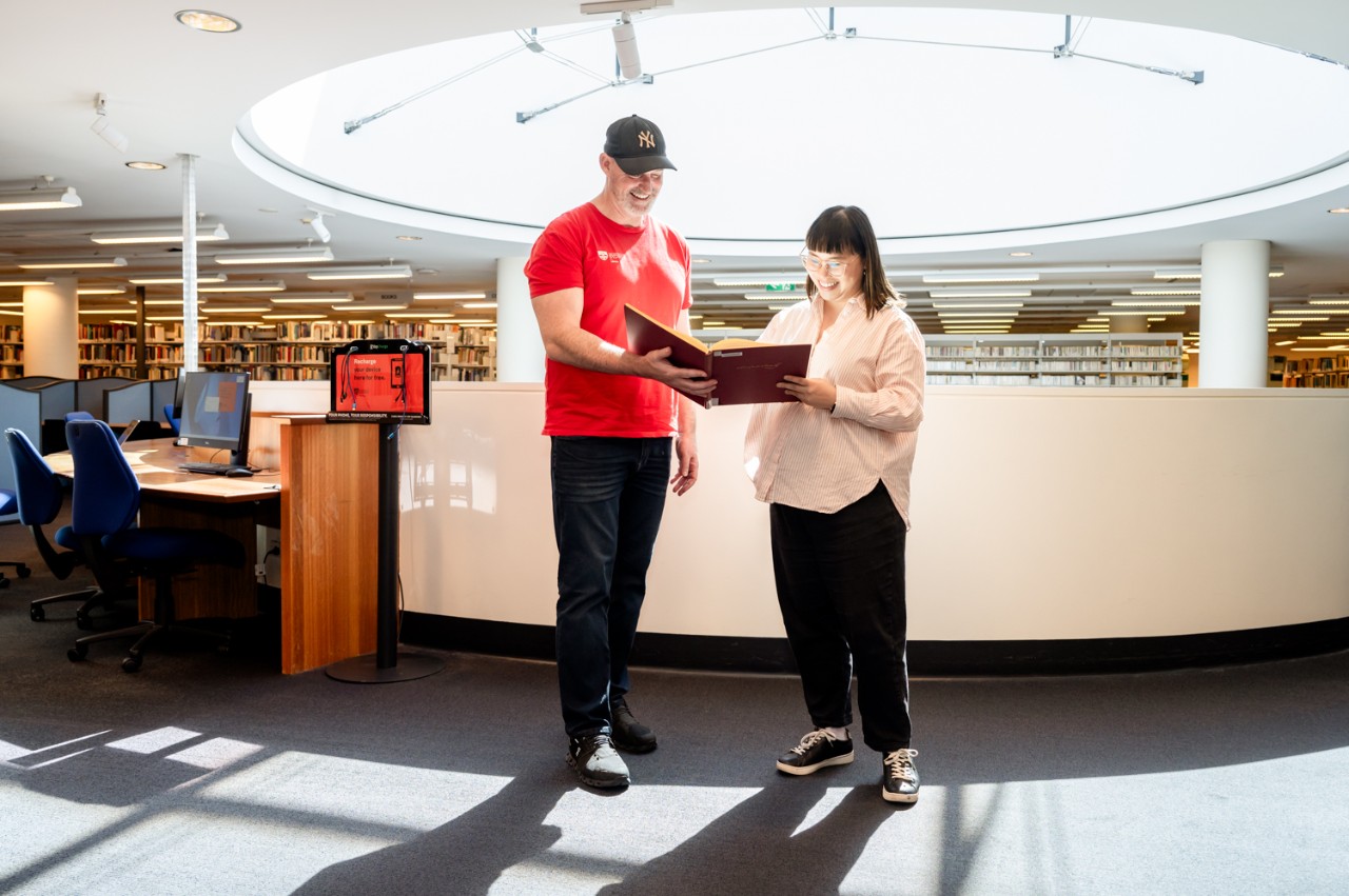 Student engaging with a Con Library staff