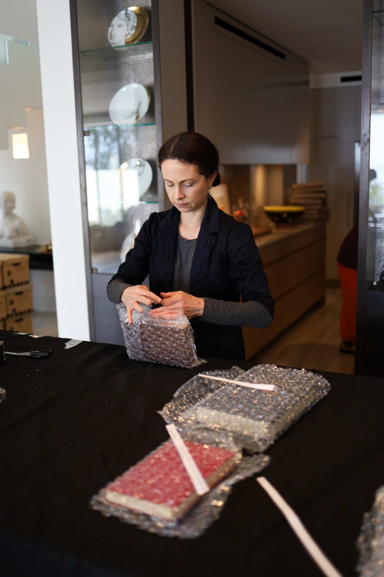 Library staff working on collection inventory and packaging