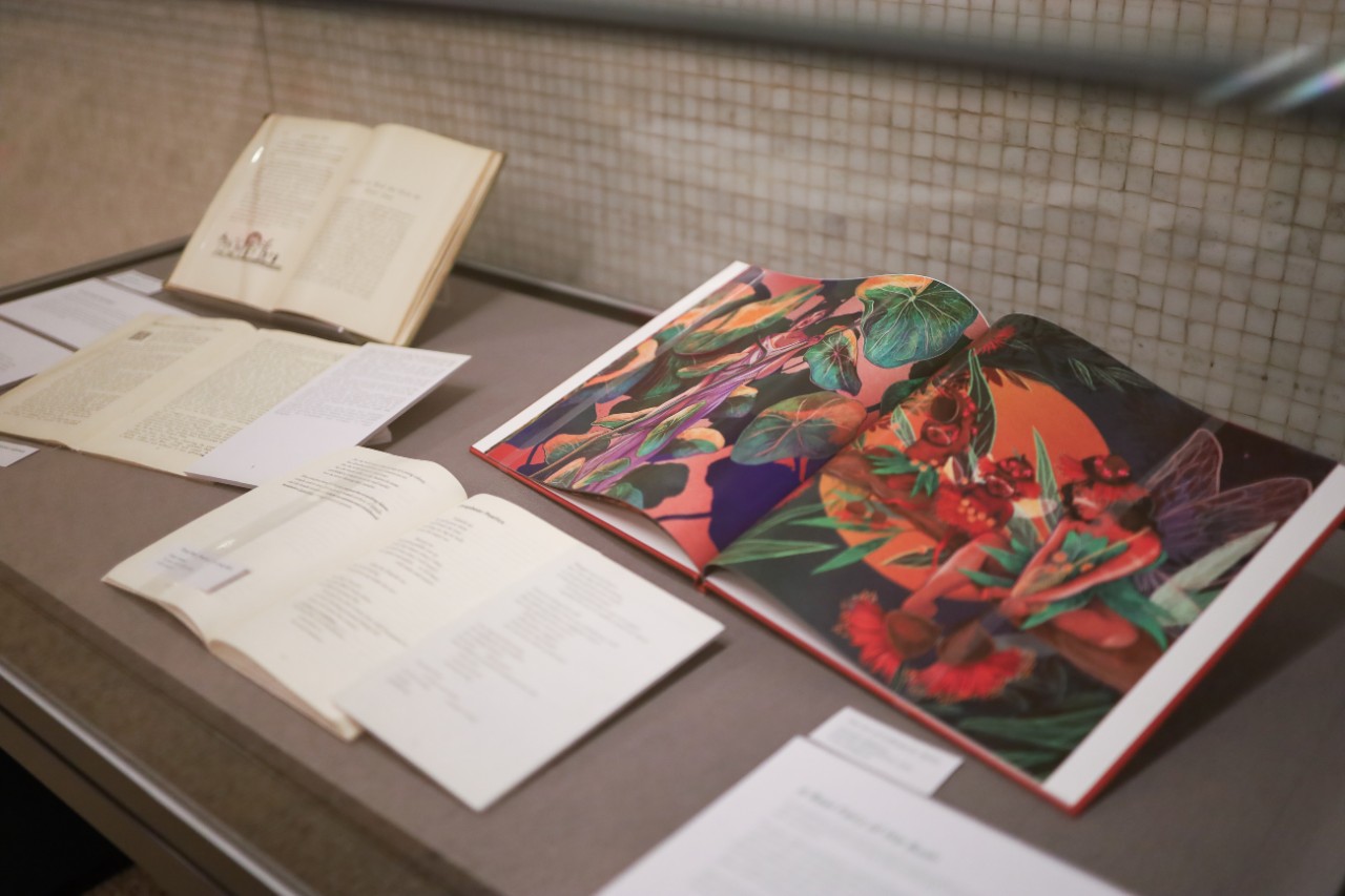 Books on display in a glass cabinet