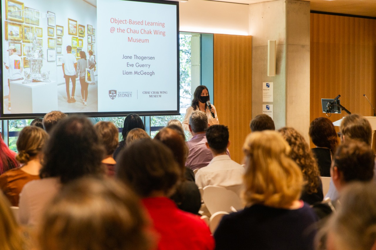 Person speaking in front of an audience