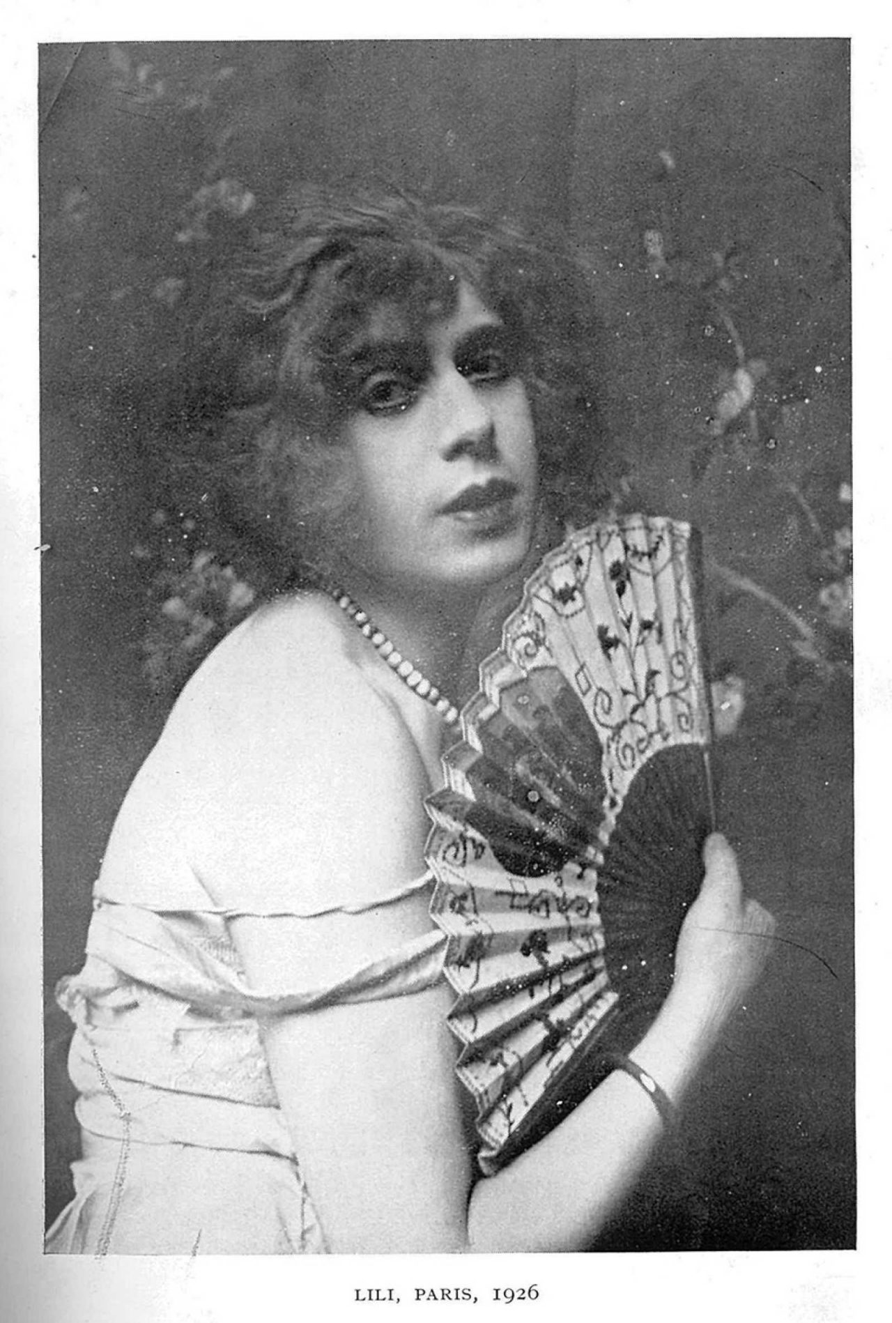 A photograph of the Danish painter Lili Elbe, whose life and transition is detailed in Man into Woman: An Authentic Record of a Change of Sex