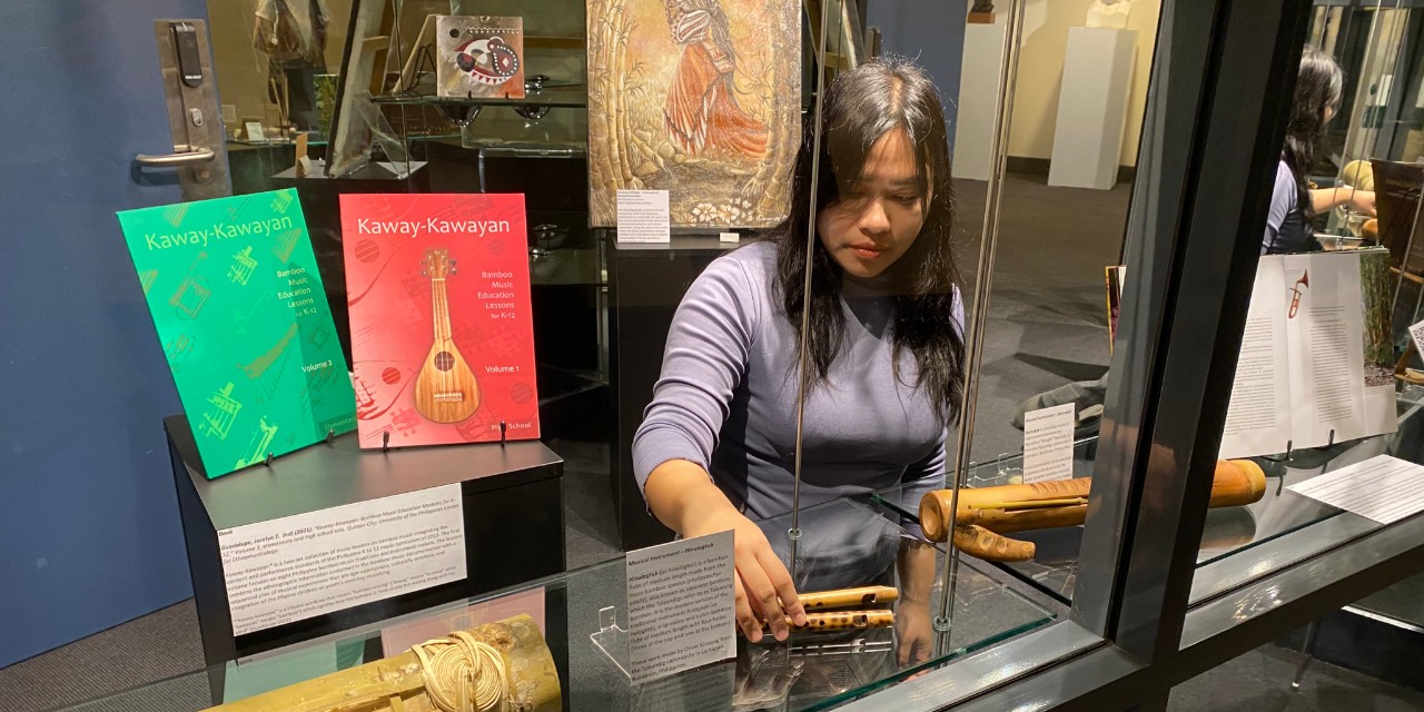 Starr Abelardo installing her exhibition at the Conservatorium Library