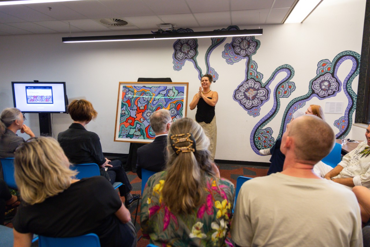 Artist Jessie Waratah speaking in front of attendees