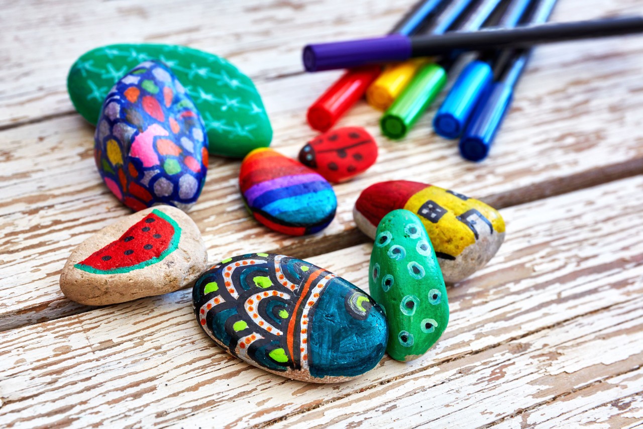 Hand-painted colorful stones and pens