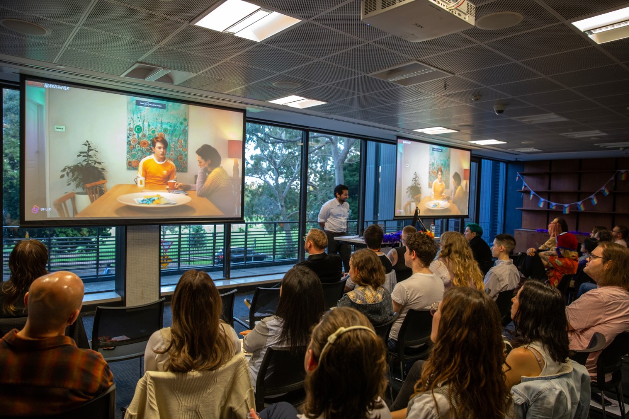 Levent Sahin presenting in front of an audience