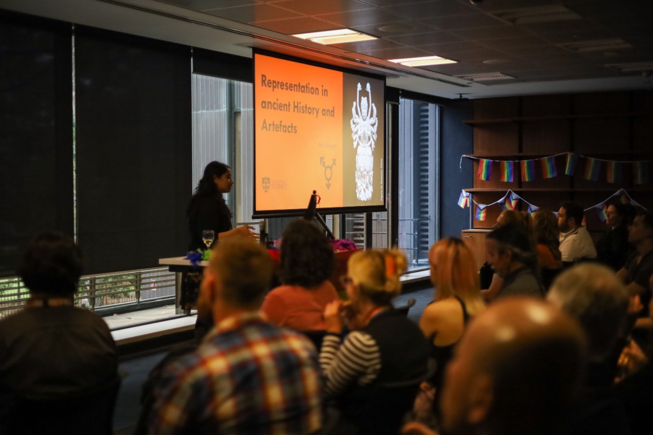 Ren Kotapati presenting in front of an audience