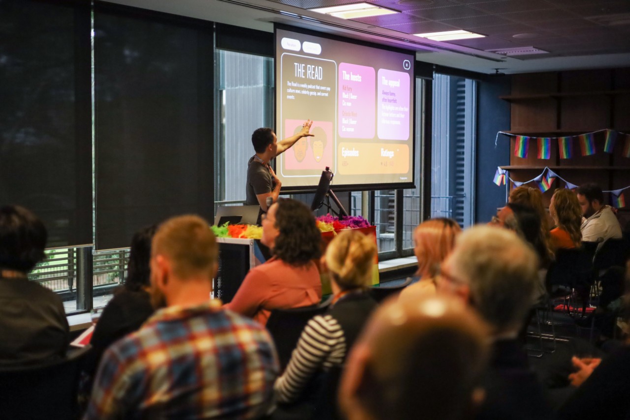 Anderson Chang presenting in front of a crowd
