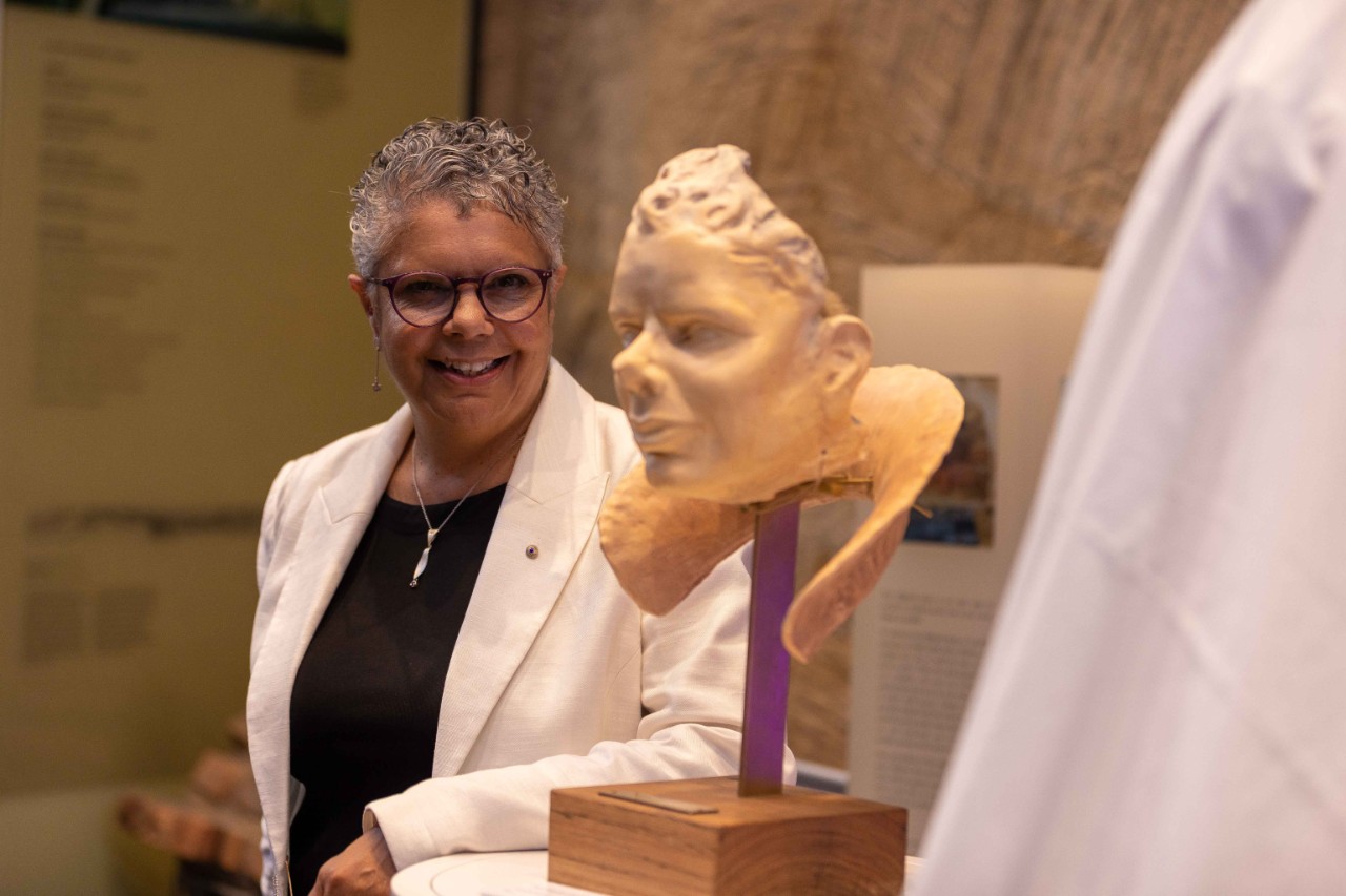 Deborah Cheetham looking at her bust