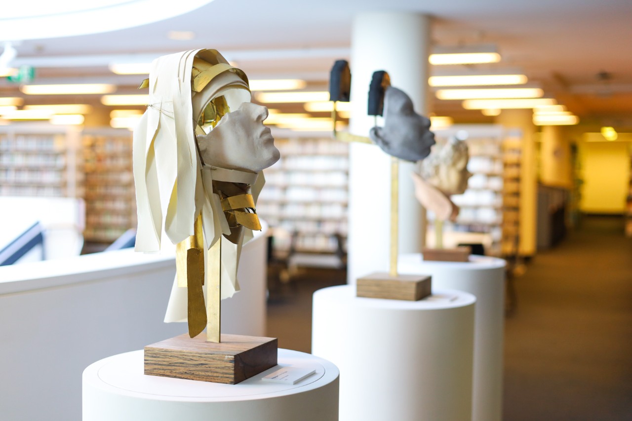 Three sculptures on plinths in the Conservatorium Library