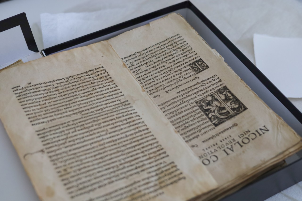 Deconstructed book pages in a box